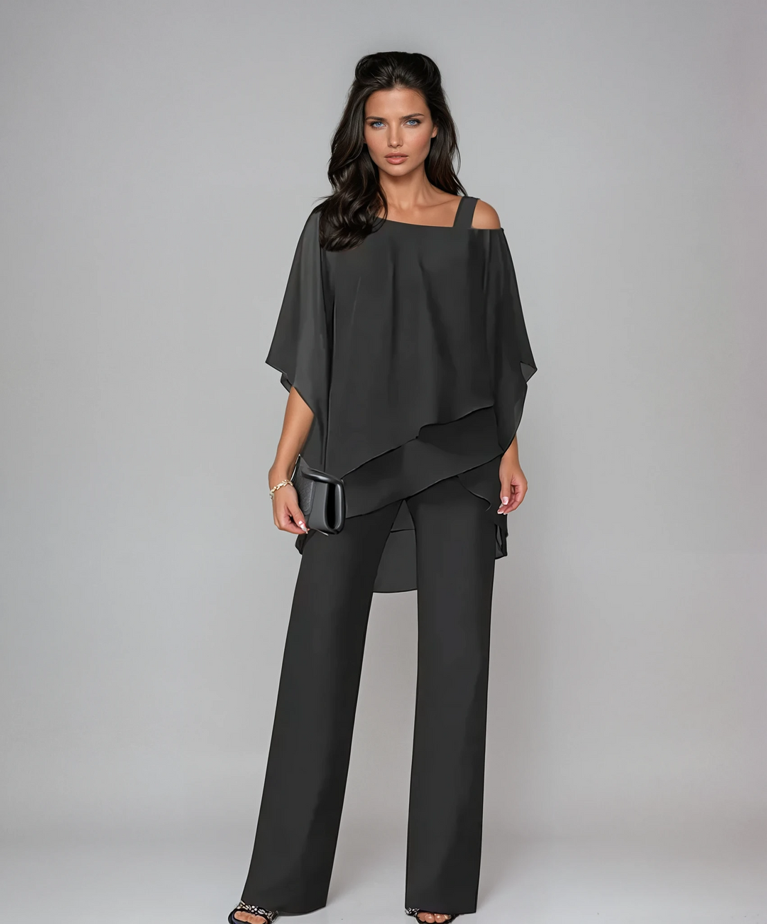 Elegant two-piece set in white with a floaty asymmetric top and wide-leg trousers