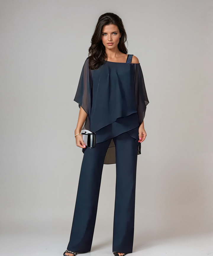 Elegant two-piece set in white with a floaty asymmetric top and wide-leg trousers