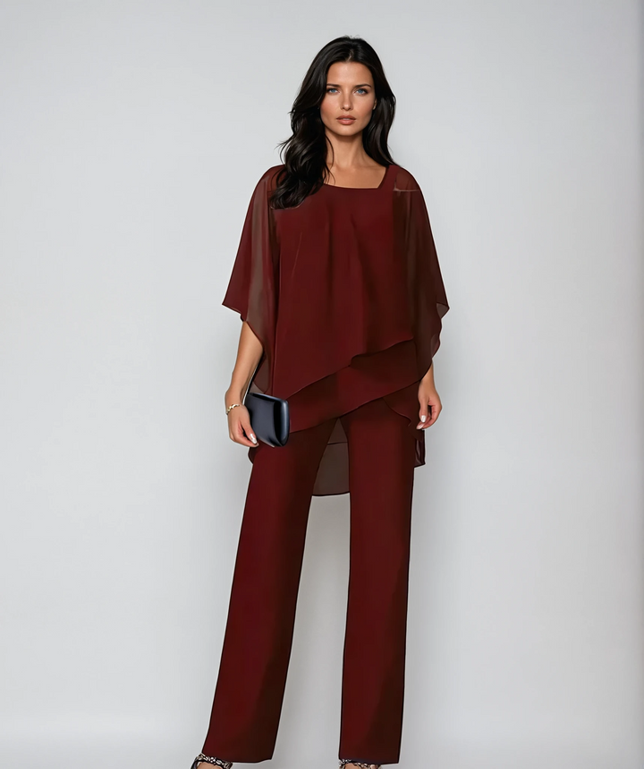 Elegant two-piece set in white with a floaty asymmetric top and wide-leg trousers