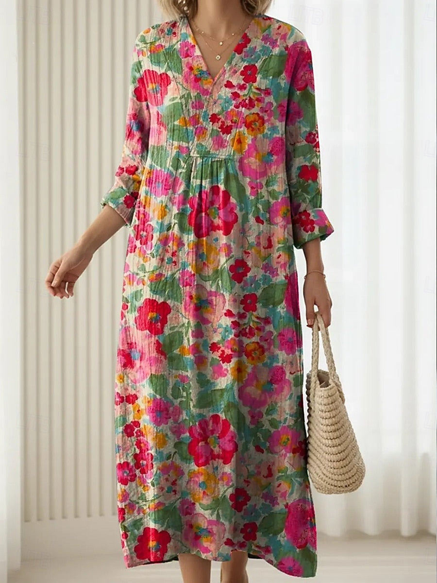 A woman wearing a light, elegant everyday dress, relaxed and beautifully put-together.