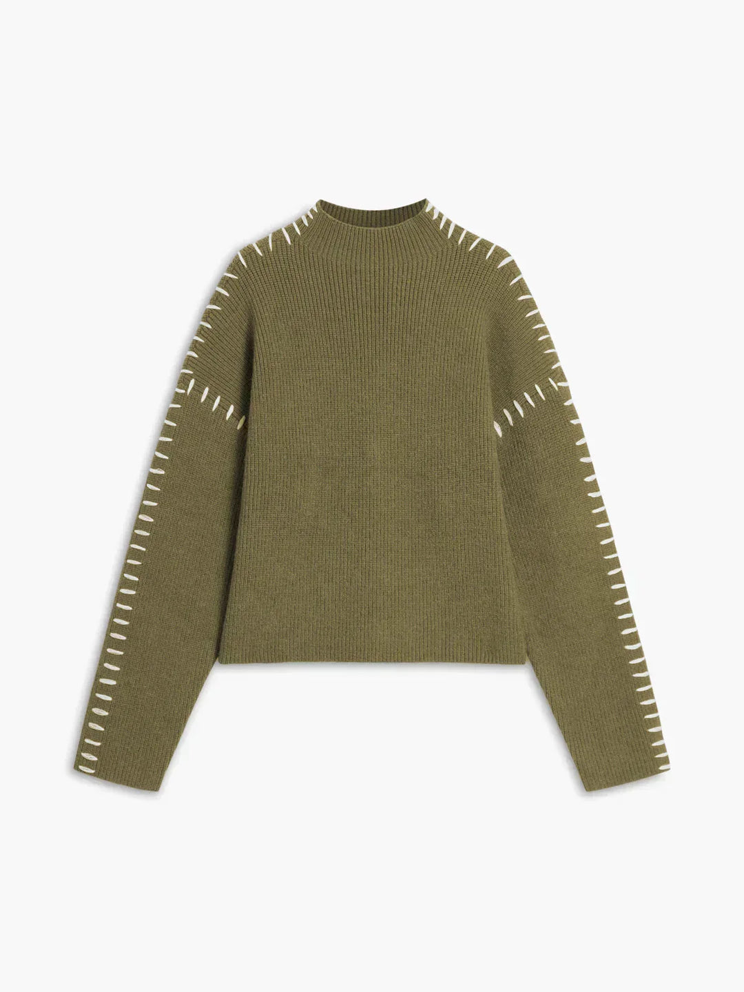 A woman wearing an oversized mock-neck jumper with whipstitch detailing, cosy and stylish.