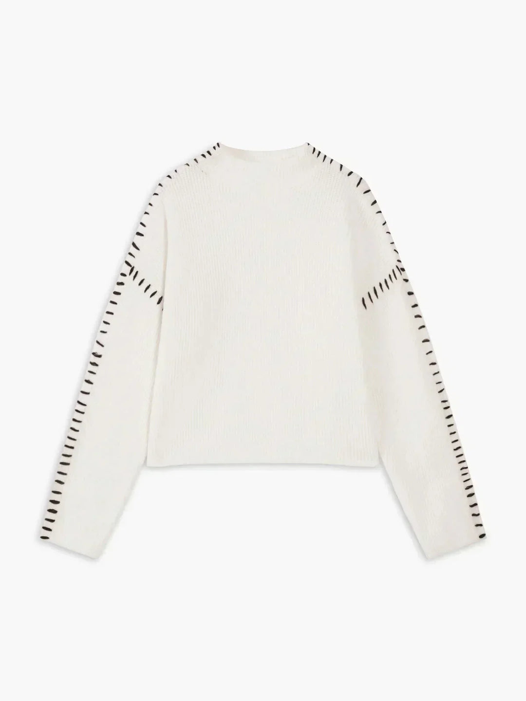 A woman wearing an oversized mock-neck jumper with whipstitch detailing, cosy and stylish.