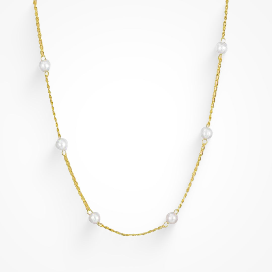 Gold initial letter pendant necklace on fine polished chain