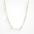 Gold initial letter pendant necklace on fine polished chain