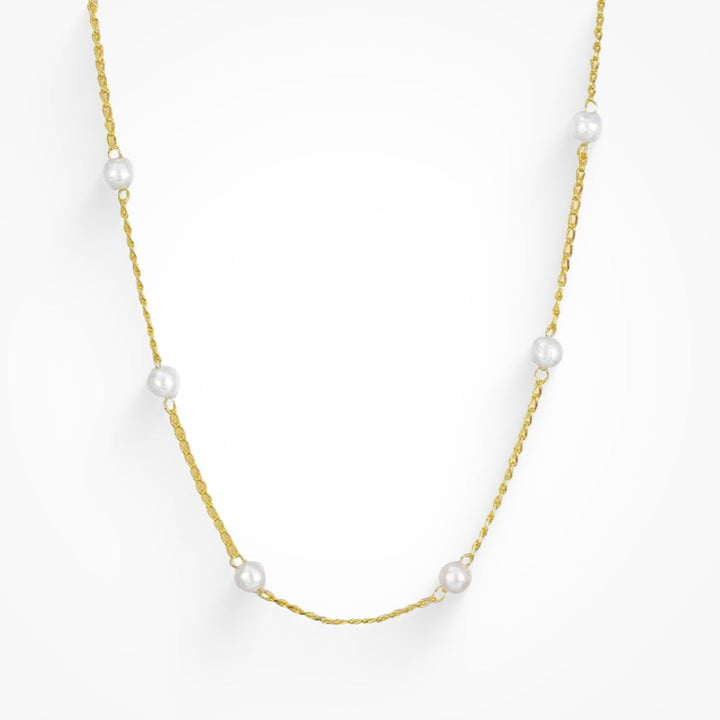 Gold initial letter pendant necklace on fine polished chain
