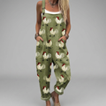 Wide-leg printed jumpsuit with warm tones, flowing silhouette and adjustable shoulder straps