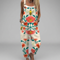 Wide-leg floaty printed jumpsuit with adjustable straps and a relaxed flowing silhouette