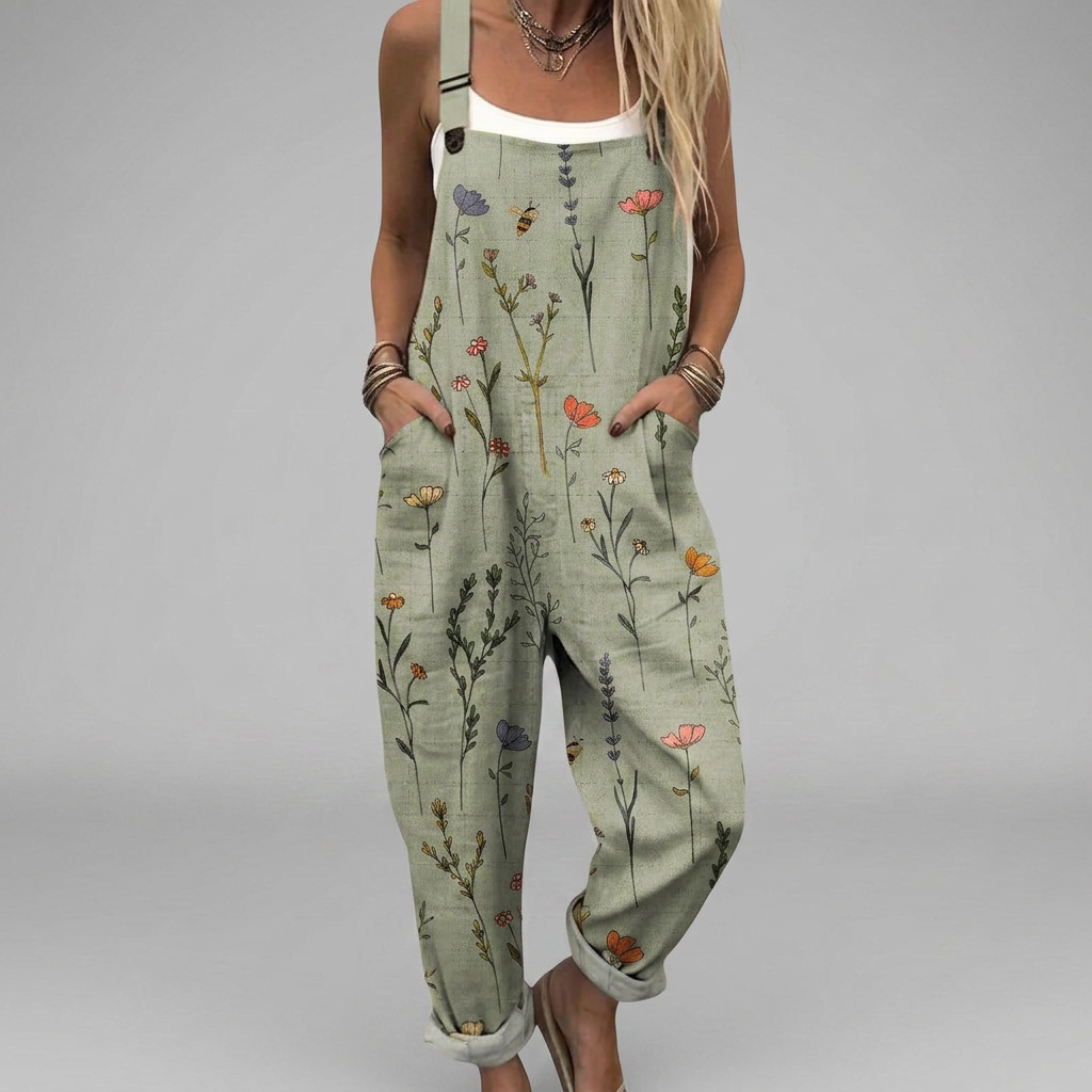 Printed wide-leg relaxed jumpsuit with adjustable straps and a flowing, elegant silhouette