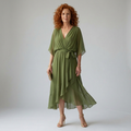 Green floaty midi dress with a draped V-neckline and soft bow waist detail