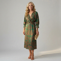 Dark green long-sleeve midi dress with diagonal wrap bodice and straight skirt in a detailed print