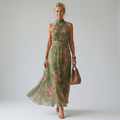 Sage green floral halter-neck midi dress with ruched neckline and flowing skirt