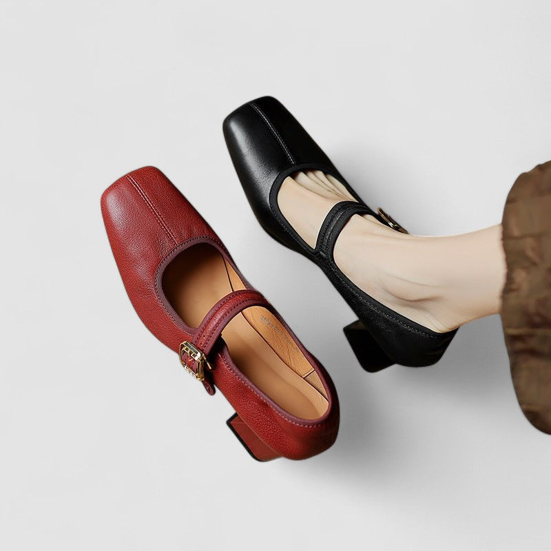 A woman in red Mary Jane shoes with a mid block heel, confident on an evening out.