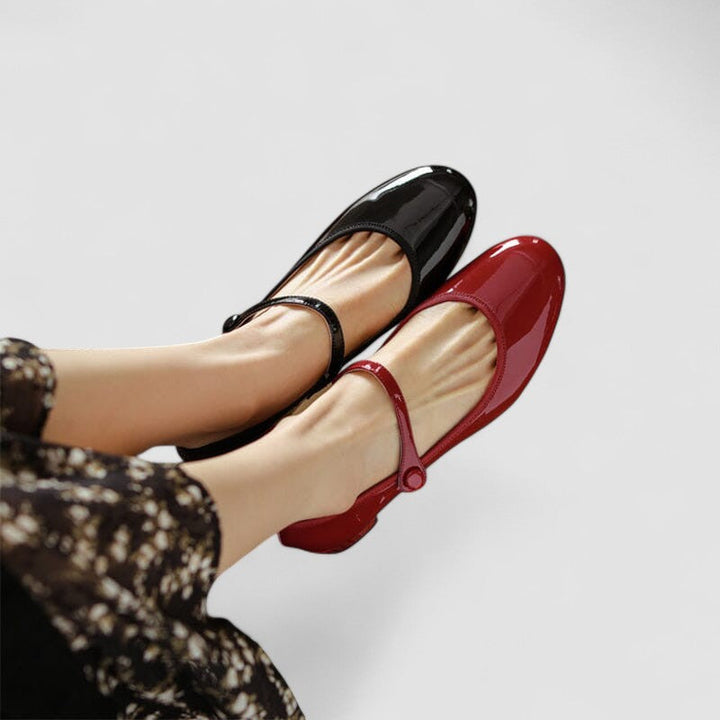 A woman wearing red Mary Jane shoes, comfortable and steady during a day of errands.
