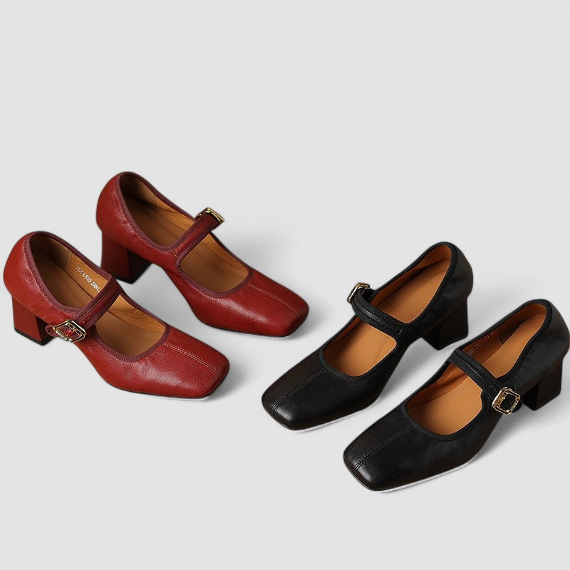 A woman in red Mary Jane shoes with a mid block heel, confident on an evening out.