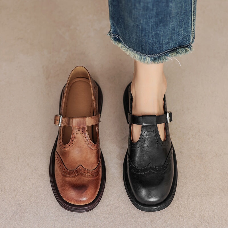 Vintage T-bar strap shoes in brown and black with a rounded toe and adjustable buckle