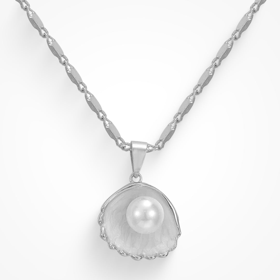 Delicate gold pendant necklace on a plain background