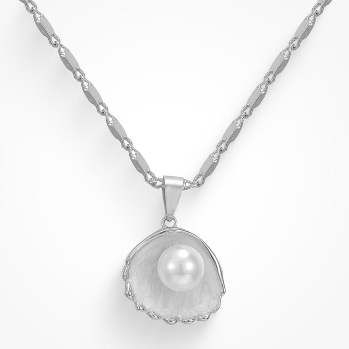 Delicate gold pendant necklace on a plain background