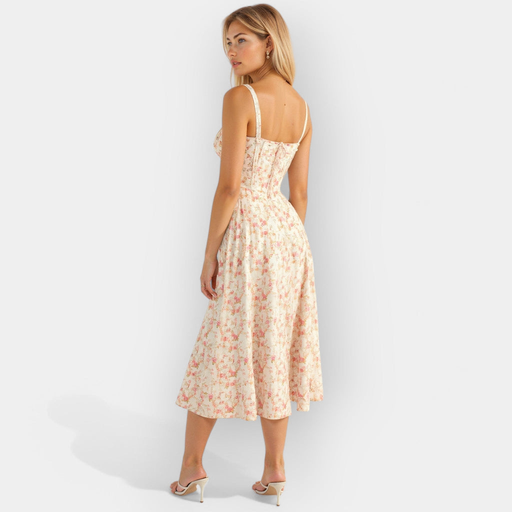 Structured corset midi dress in soft pink with a smooth flowing skirt