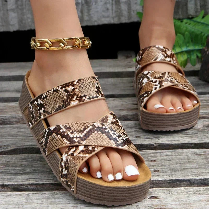 Brown cross-strap wedge sandals with backless design and cushioned sole