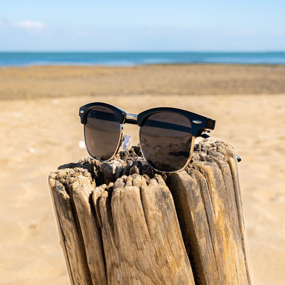 Men's vintage classic sunglasses in black and gold with a refined, understated frame