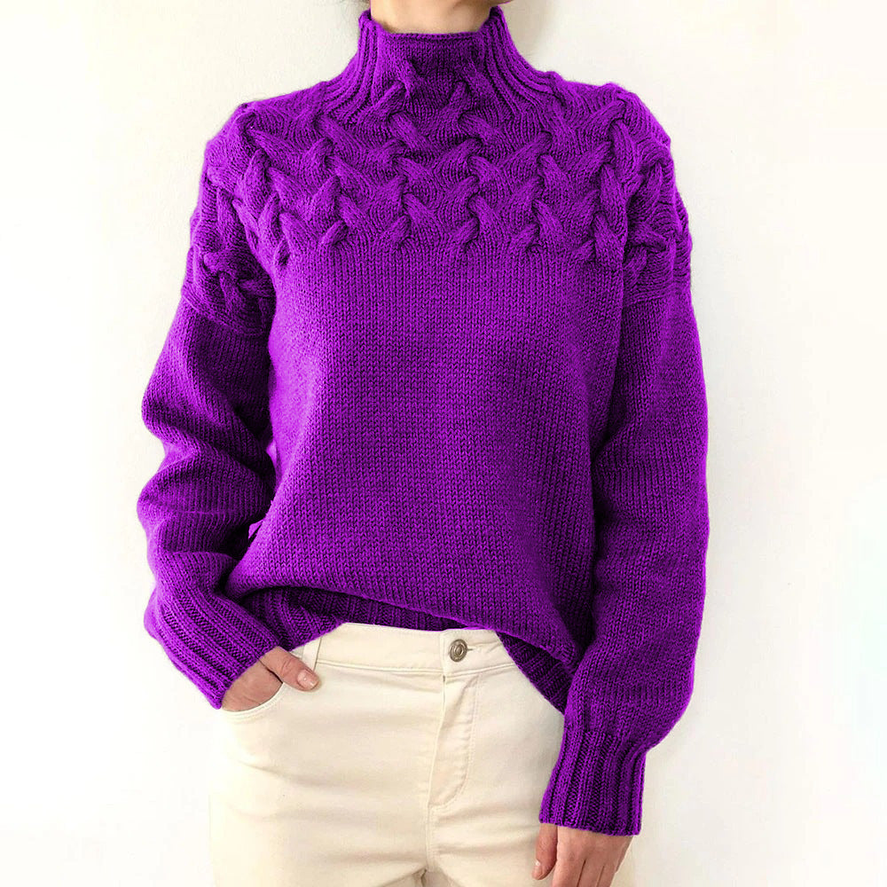 A woman wearing a warm roll-neck jumper, cosy and elegant on a cold winter day.