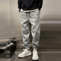 Men's jogger trousers in grey, black and dark navy with a modern tapered relaxed silhouette