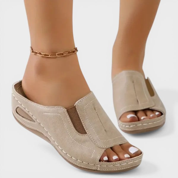 Women's orthopedic sandals in black with a cushioned footbed and lightweight strapped upper