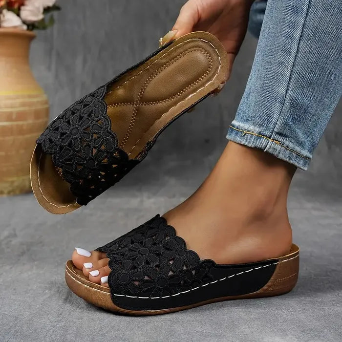 Blue scalloped wedge sandals with open design and cushioned base