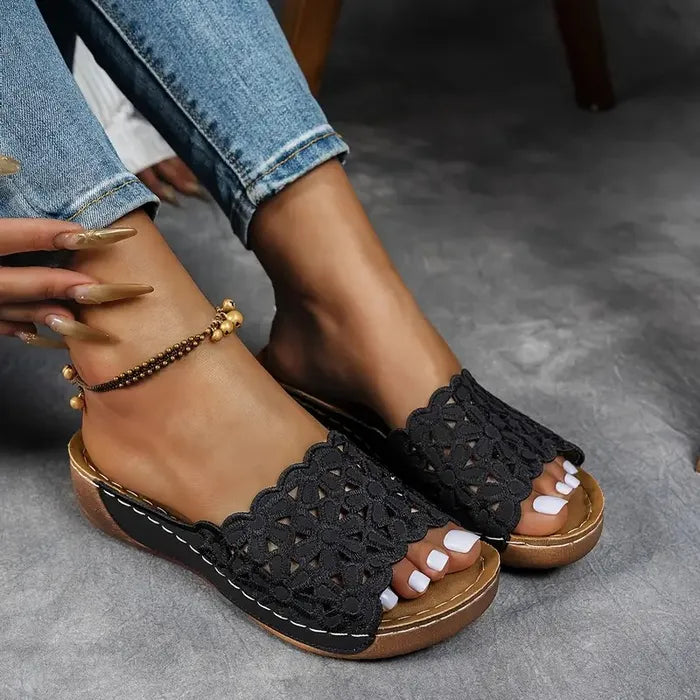 Blue scalloped wedge sandals with open design and cushioned base
