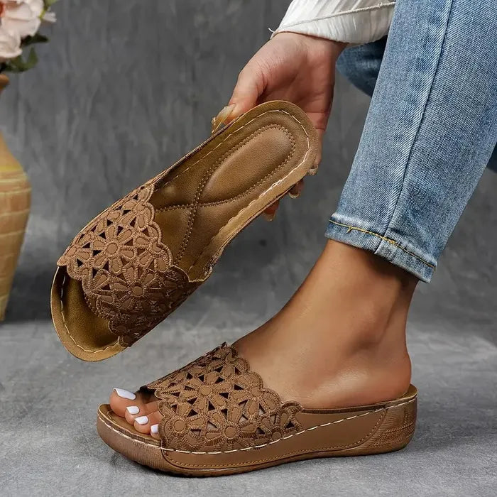Blue scalloped wedge sandals with open design and cushioned base