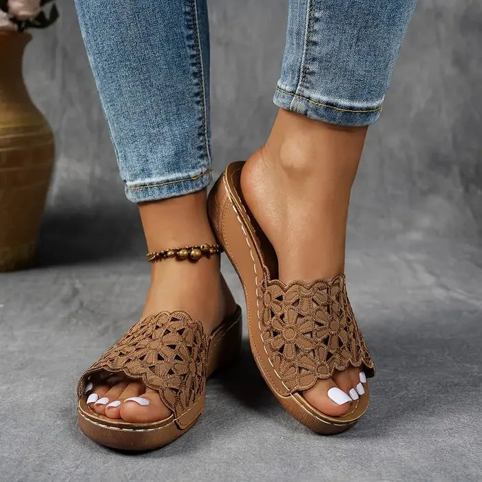 Blue scalloped wedge sandals with open design and cushioned base