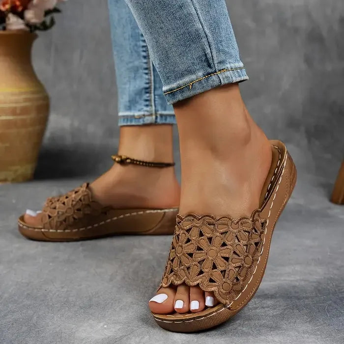 Blue scalloped wedge sandals with open design and cushioned base