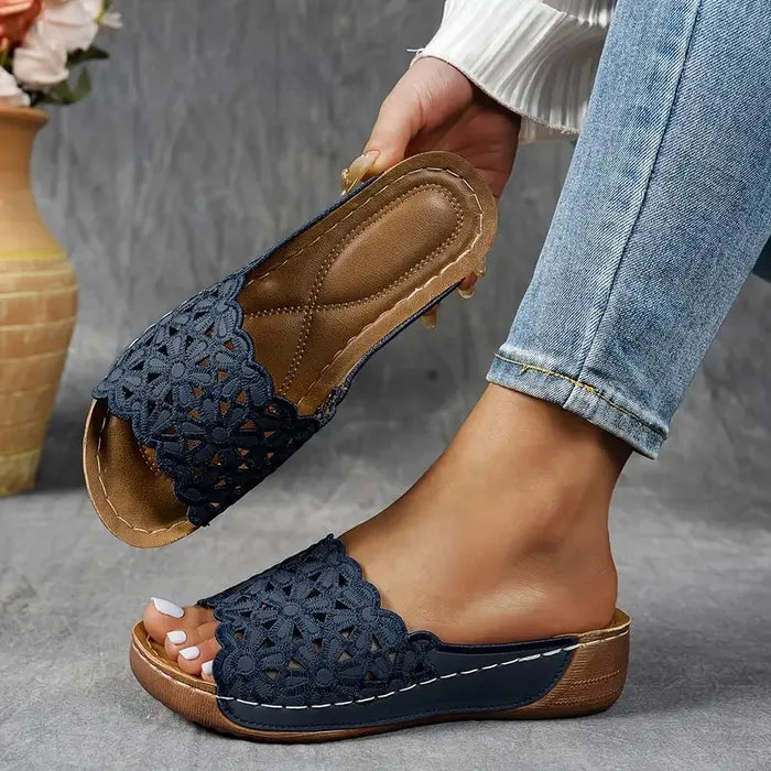 Blue scalloped wedge sandals with open design and cushioned base