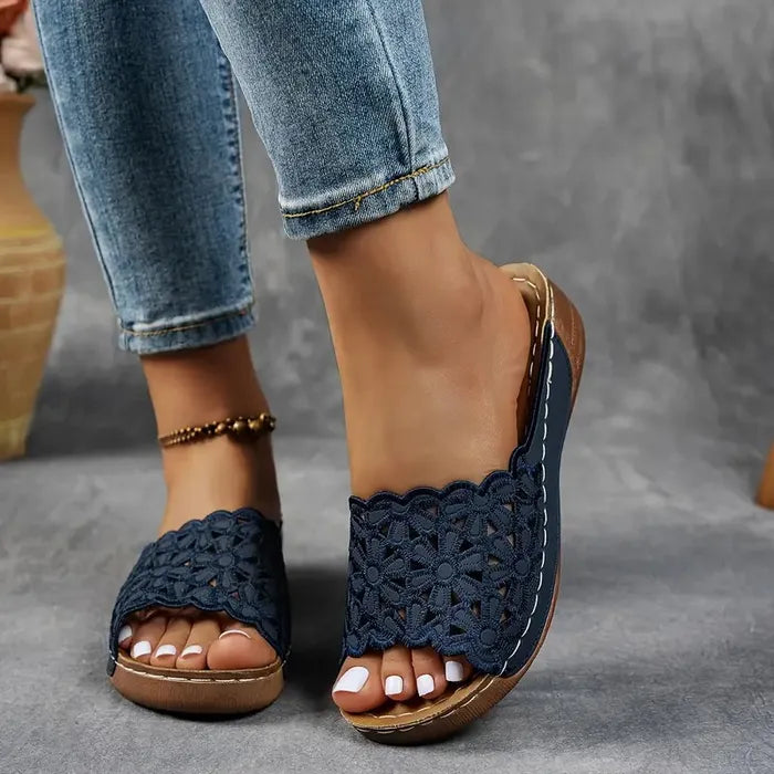 Blue scalloped wedge sandals with open design and cushioned base