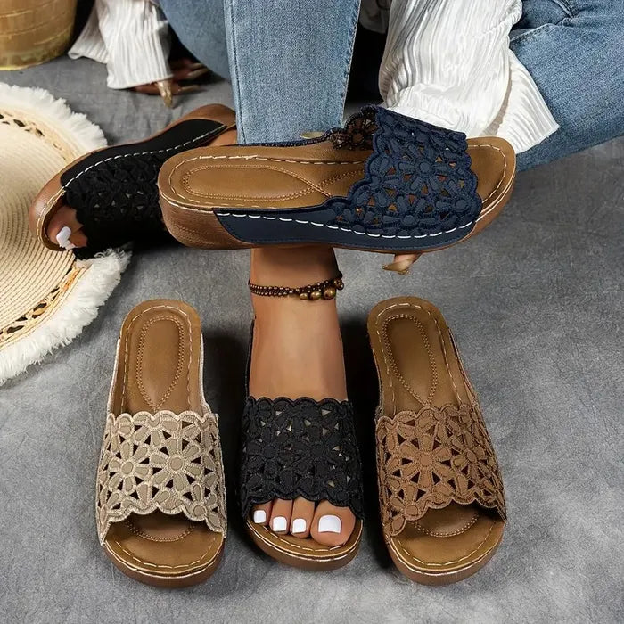 Blue scalloped wedge sandals with open design and cushioned base