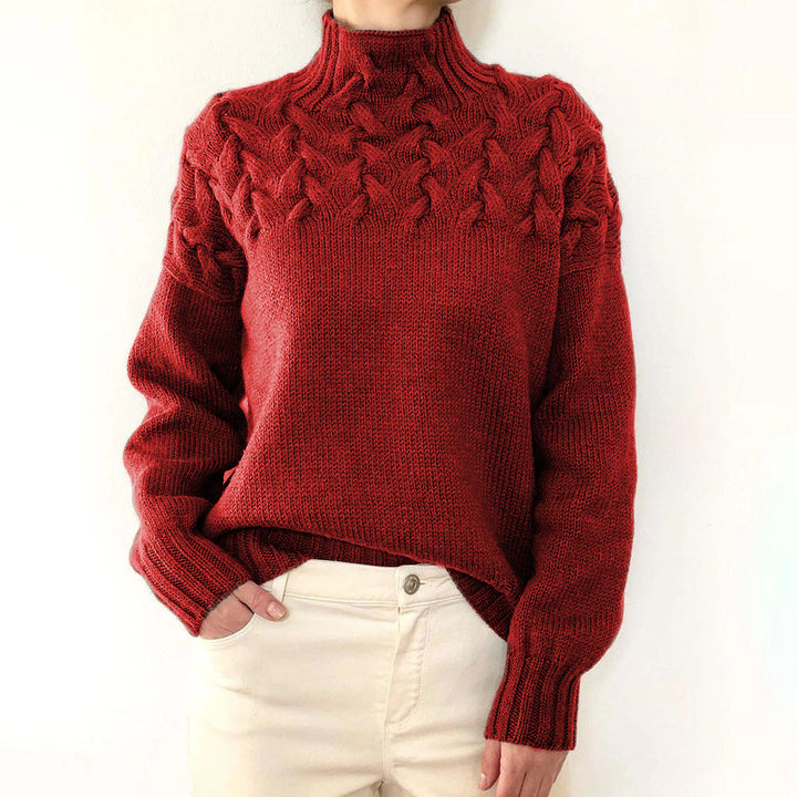 A woman wearing a warm roll-neck jumper, cosy and elegant on a cold winter day.