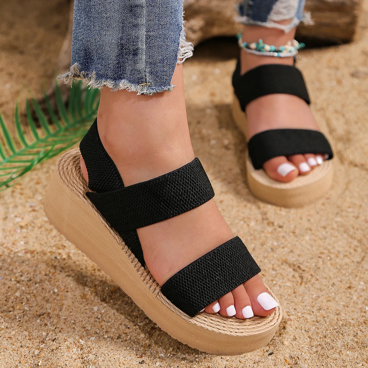 Platform sandals with double elastic straps in beige, offering a comfortable lift