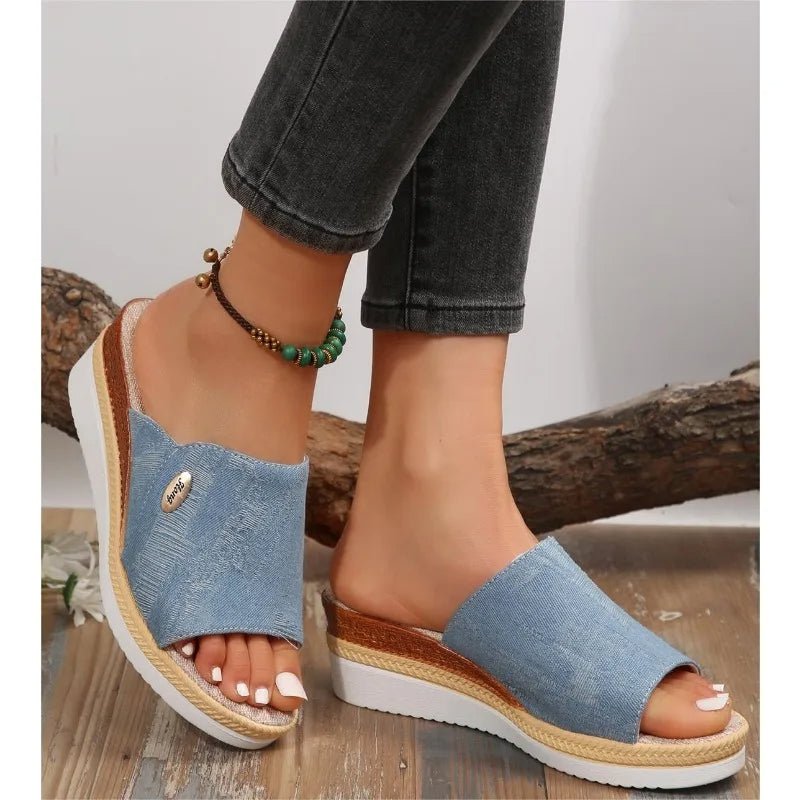 Wide-strap backless wedge sandals in navy with a small metallic trim detail
