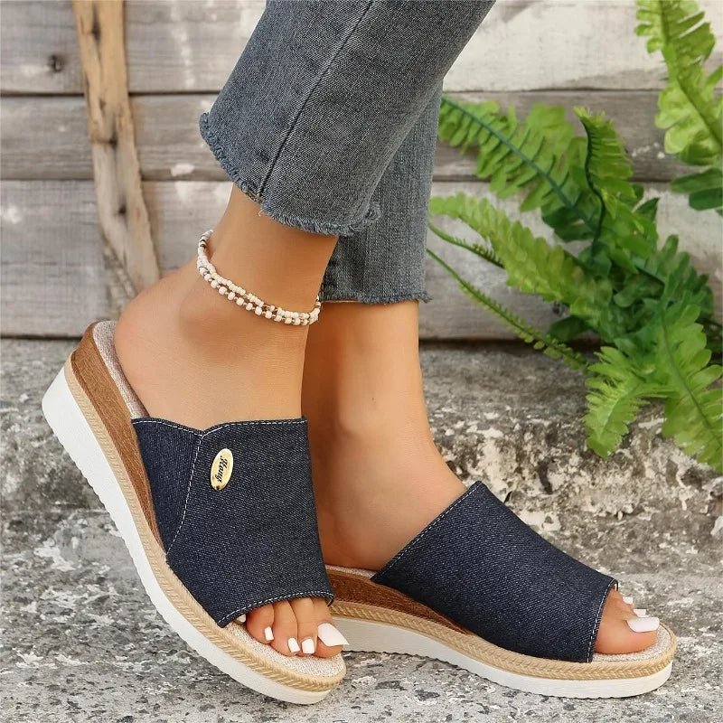 Wide-strap backless wedge sandals in navy with a small metallic trim detail