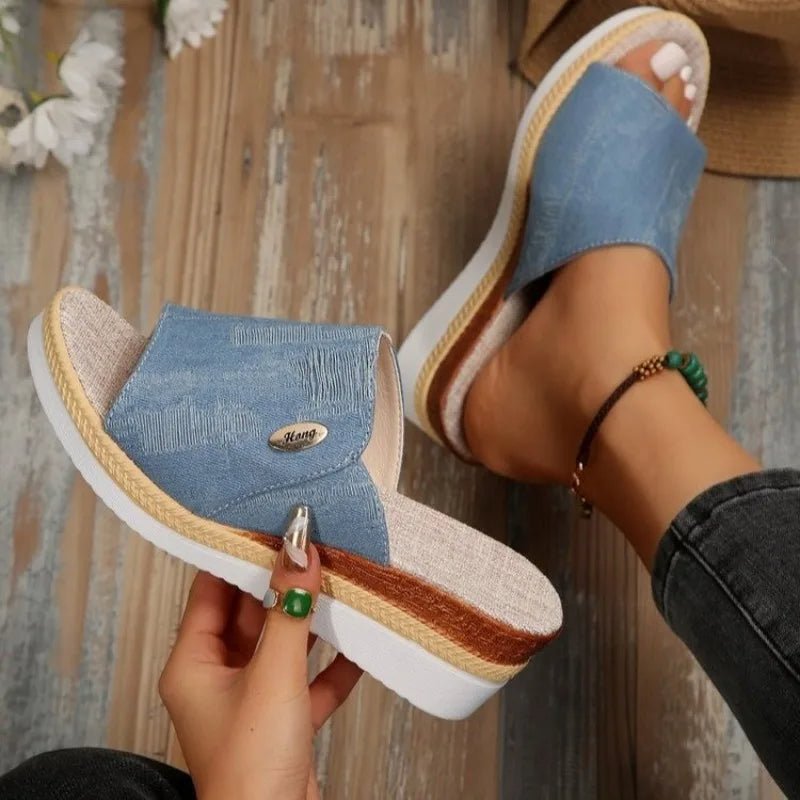 Wide-strap backless wedge sandals in navy with a small metallic trim detail