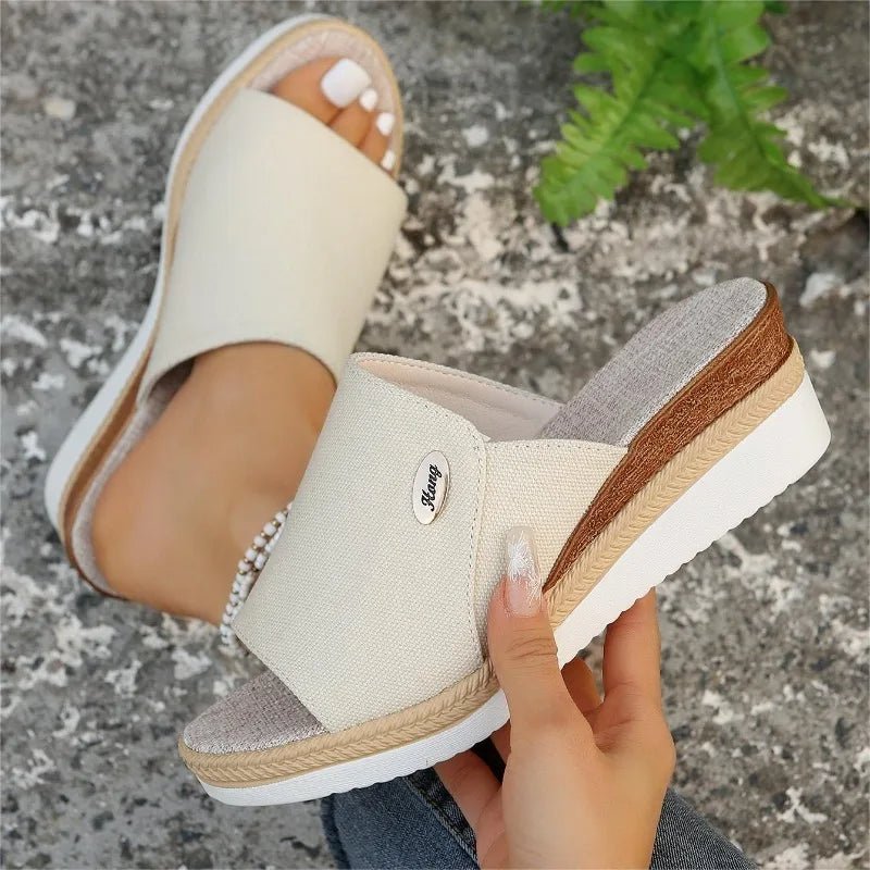 Wide-strap backless wedge sandals in navy with a small metallic trim detail