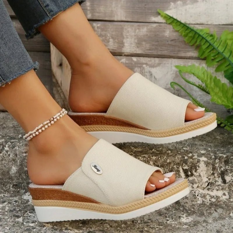 Wide-strap backless wedge sandals in navy with a small metallic trim detail