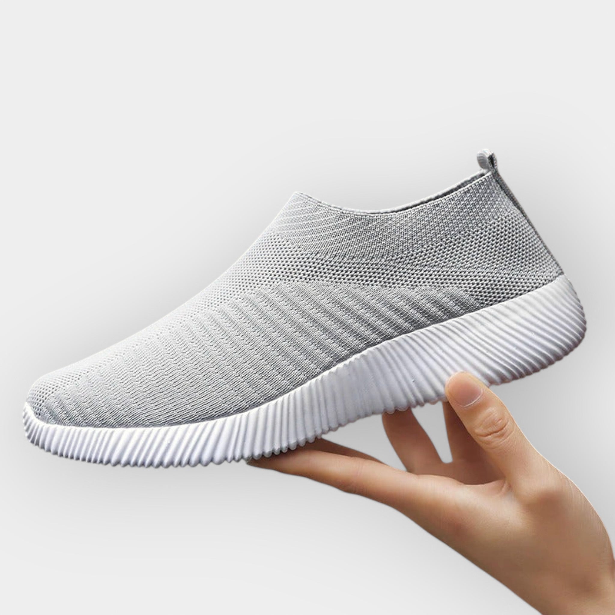 Women's breathable slip-on shoes in white with a cushioned ergonomic sole