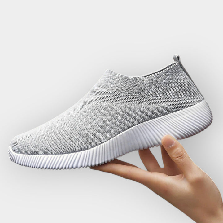 Women's breathable slip-on shoes in white with a cushioned ergonomic sole