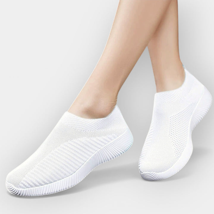 Women's breathable slip-on shoes in white with a cushioned ergonomic sole