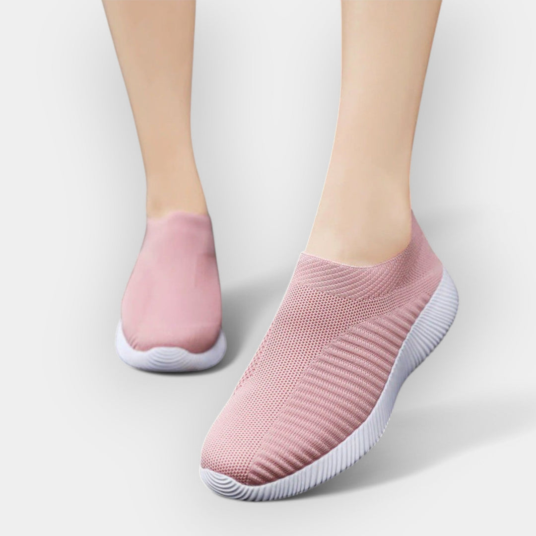 Women's breathable slip-on shoes in white with a cushioned ergonomic sole