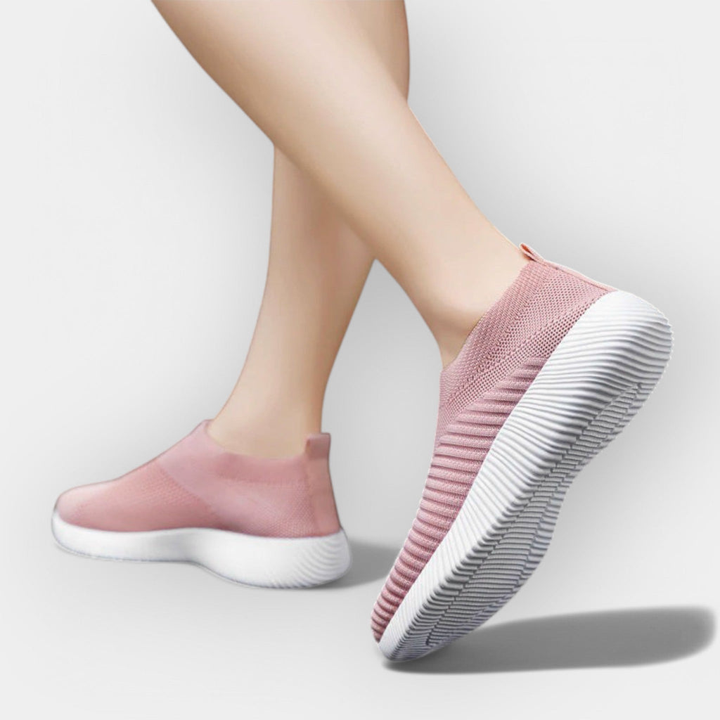 Women's breathable slip-on shoes in white with a cushioned ergonomic sole