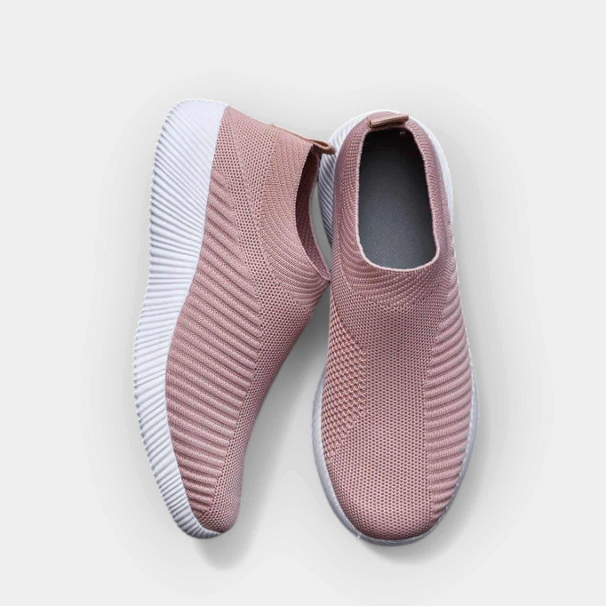 Women's breathable slip-on shoes in white with a cushioned ergonomic sole