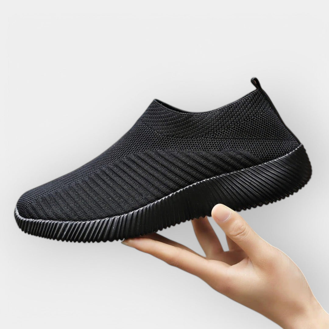 Women's breathable slip-on shoes in white with a cushioned ergonomic sole