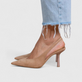 Pointed toe slingback heels in beige and black with a slender, minimalist heel